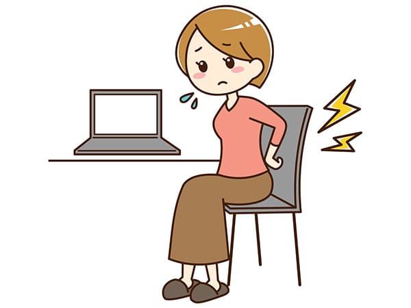 腰が痛むデスクワークの女性イラスト
